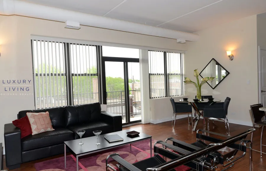 kitchen and island with wood floors at Riverview Terrace Apartments