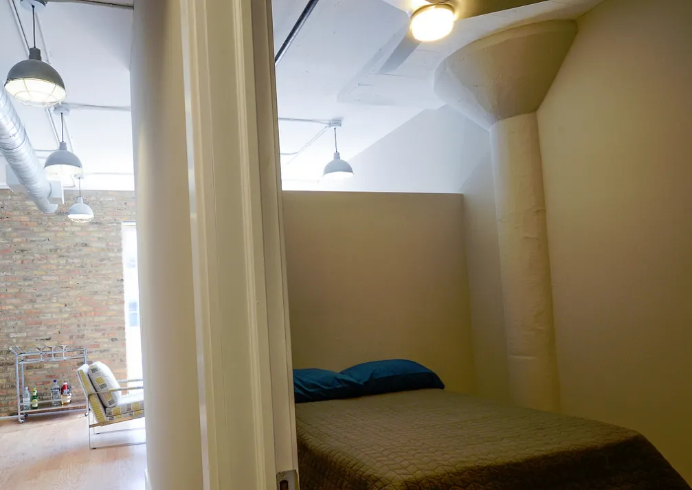 exposed brick in living room of 3141 North Sheffield Apartments in Lakeview