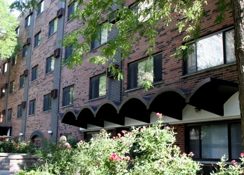 sidewalk view of the front of 421-431 West Barry Apartments in Lakeview