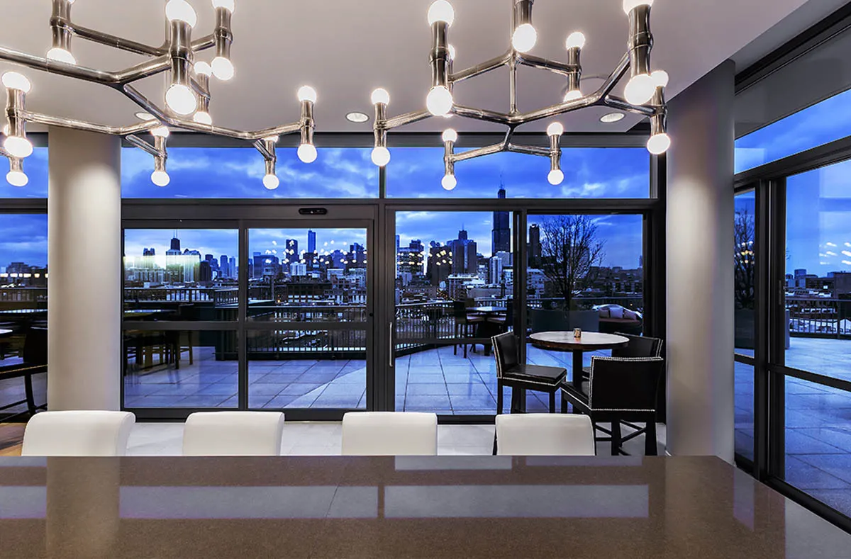kitchen with view of living room at The Madison at Racine Apartments