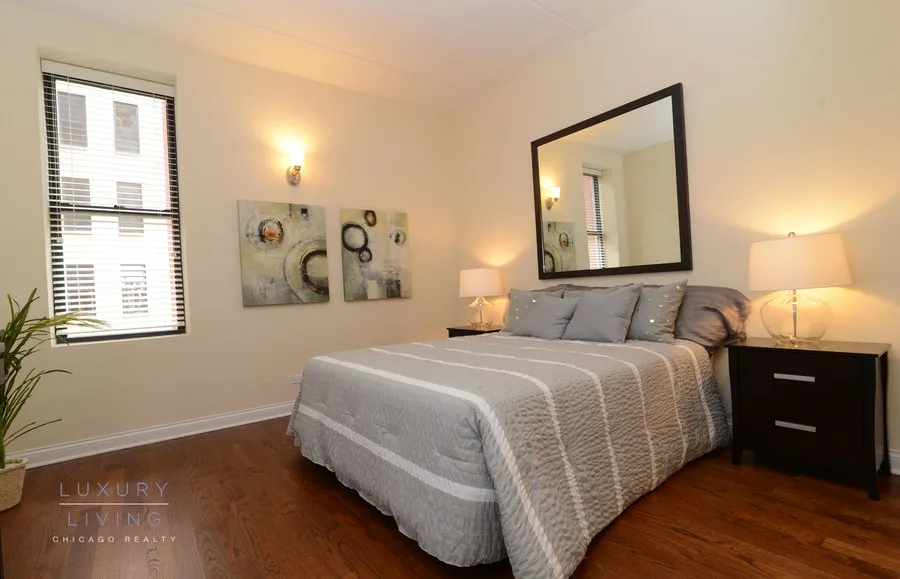 kitchen and island with wood floors at Riverview Terrace Apartments