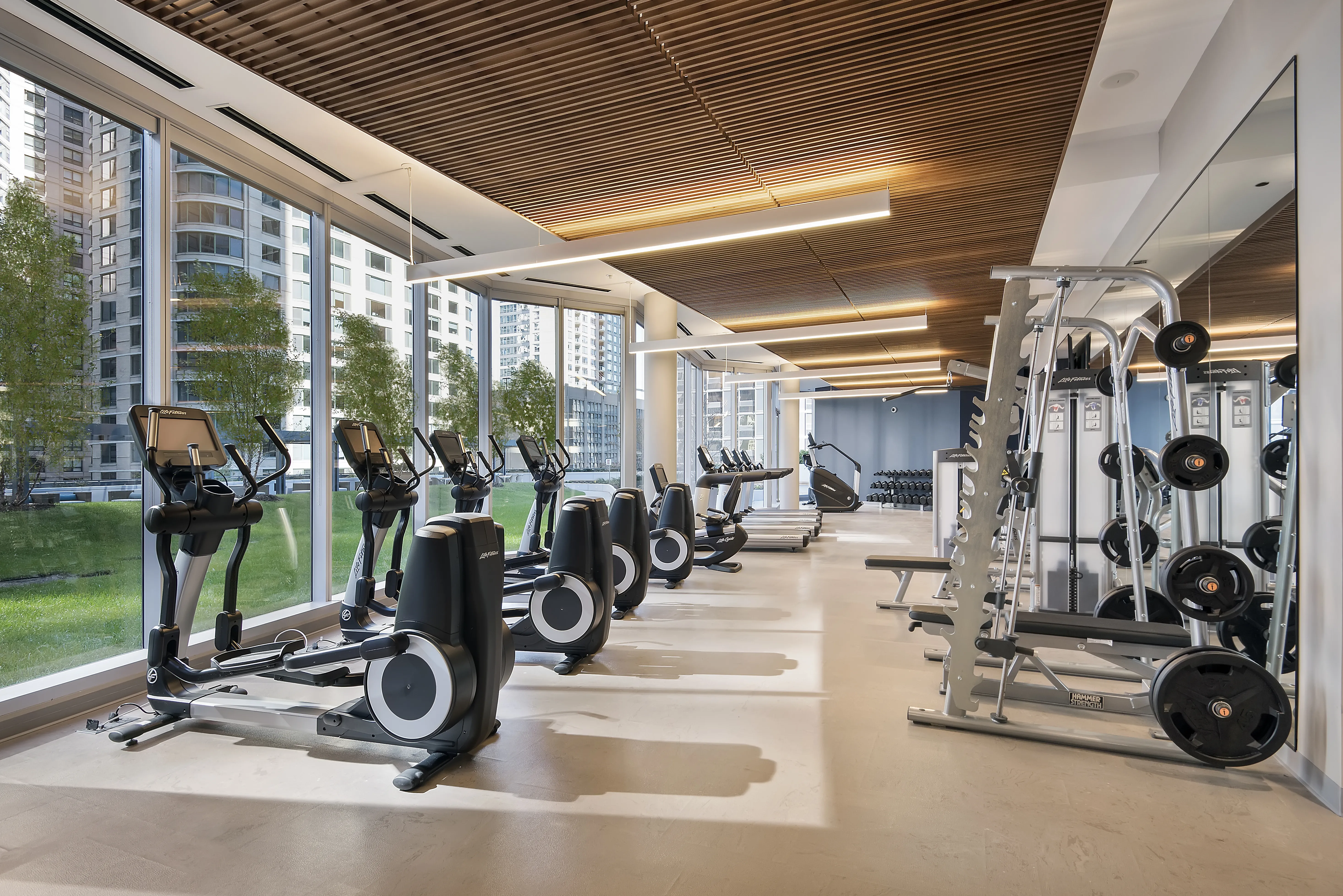 living room with brown couch at Moment Apartments in Streeterville Chicago