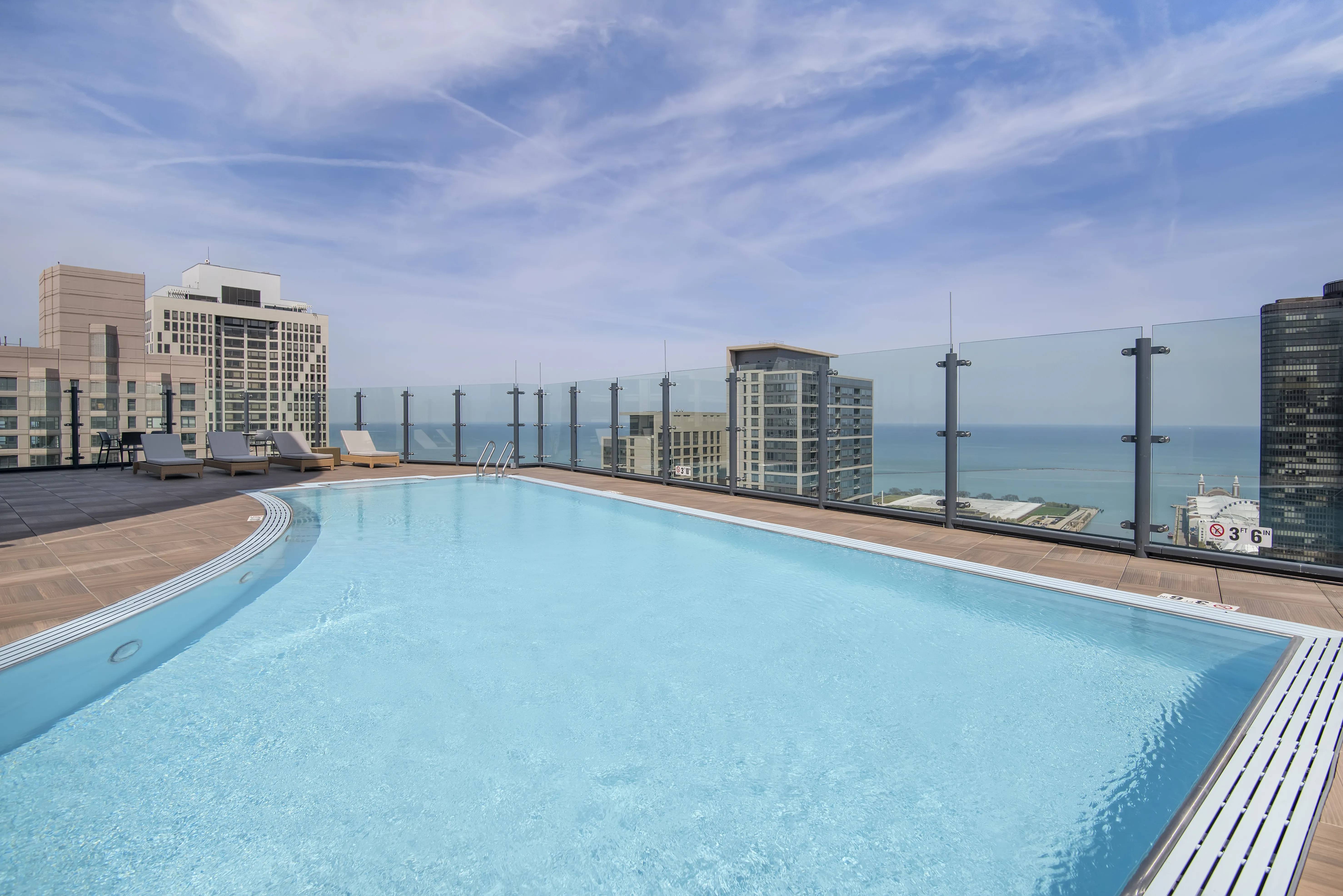 living room with brown couch at Moment Apartments in Streeterville Chicago