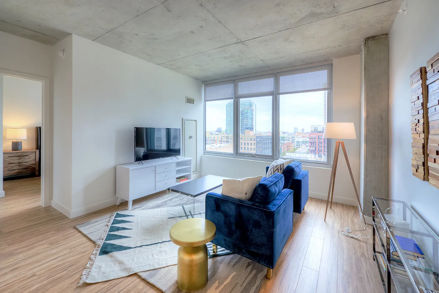 living room and dining room madel apartment at Emme Chicago Apartments