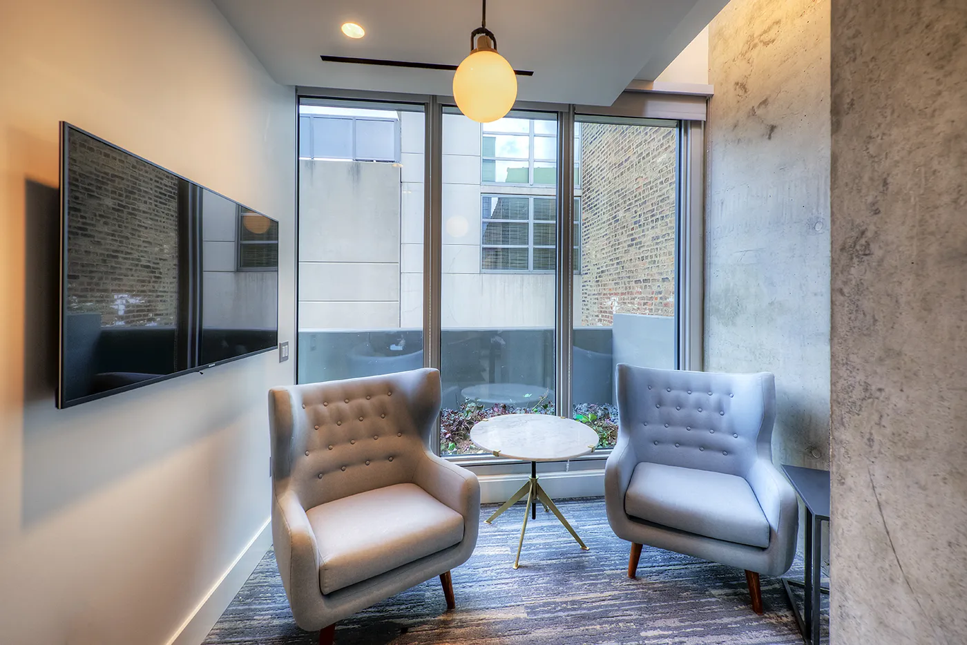 living room and dining room madel apartment at Emme Chicago Apartments