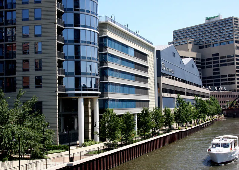 exterior view along river and East Bank Club
