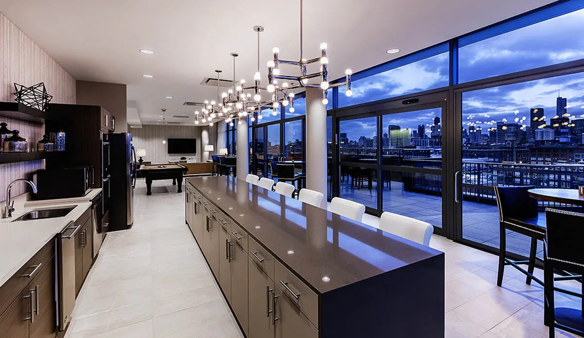 kitchen with view of living room at The Madison at Racine Apartments