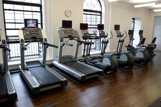 lobby entrance with limestone facade at The Belmont By Reside Apartments