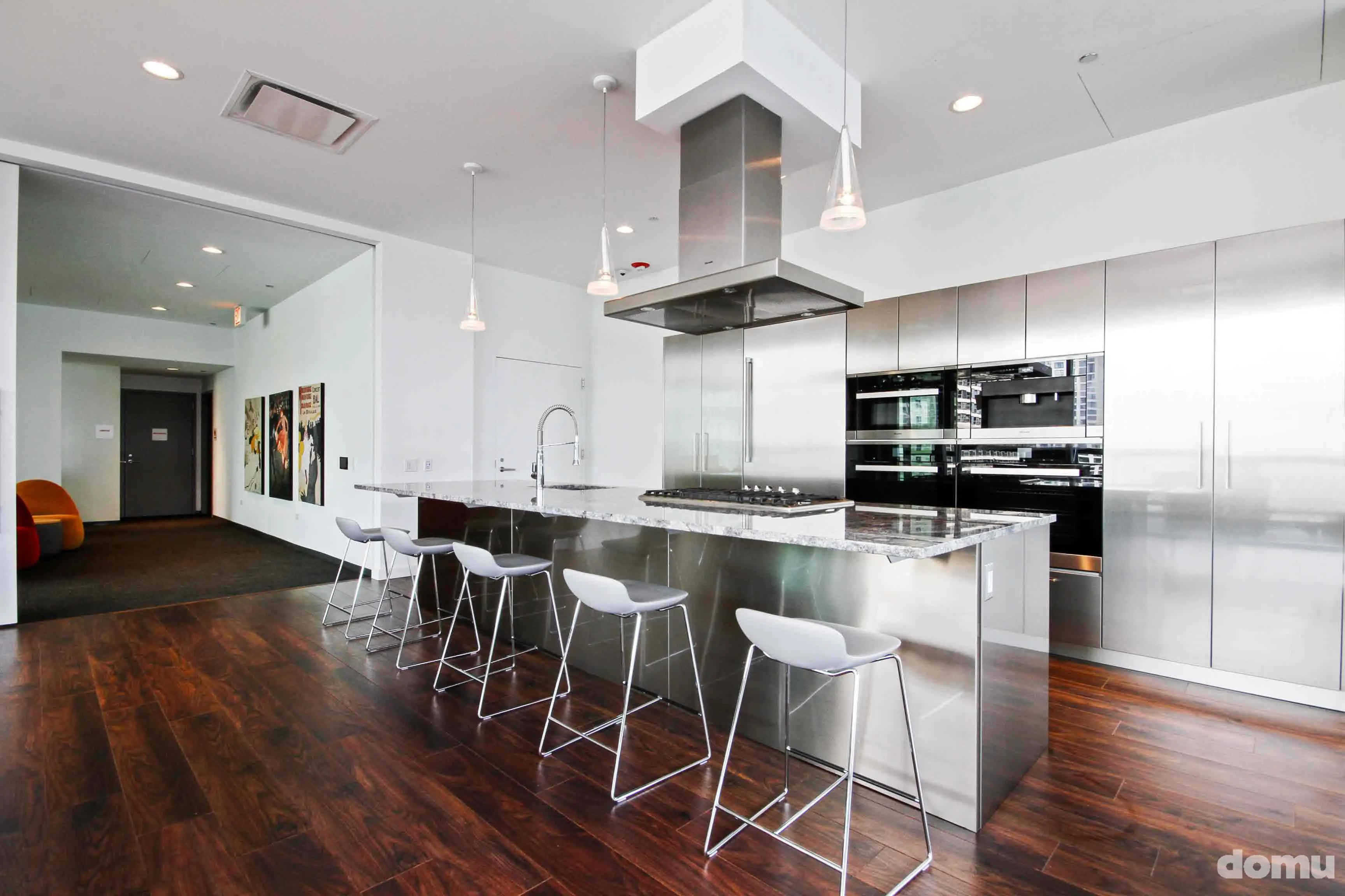 model kitchen with view of Chicago at Optima Signature Apartments