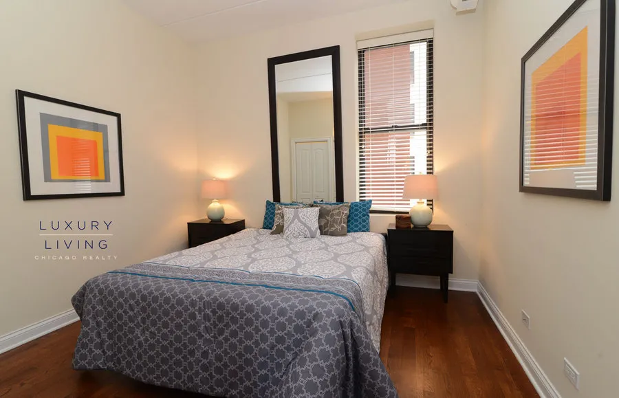 kitchen and island with wood floors at Riverview Terrace Apartments