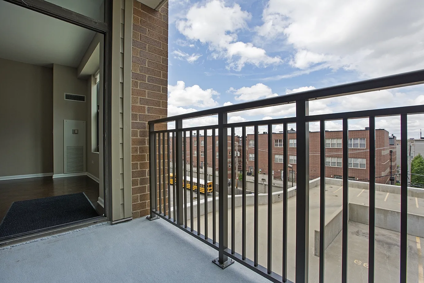 modern kitchen with brown wood cabints at The Shelby Apartments in Chicago