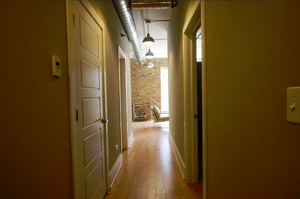exposed brick in living room of 3141 North Sheffield Apartments in Lakeview