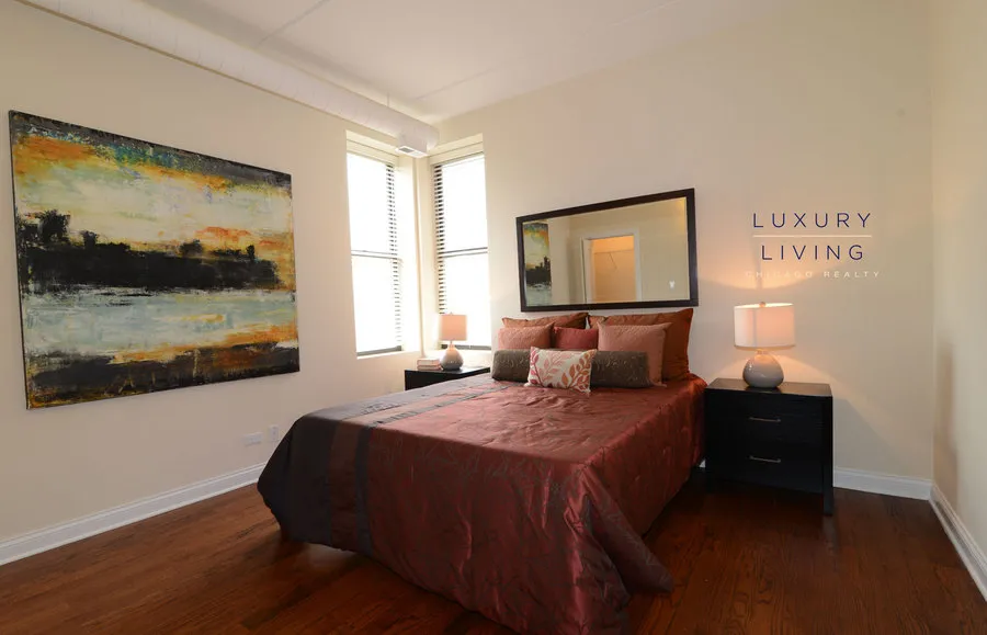 kitchen and island with wood floors at Riverview Terrace Apartments