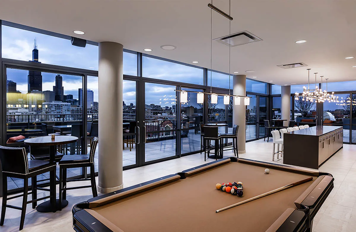 kitchen with view of living room at The Madison at Racine Apartments