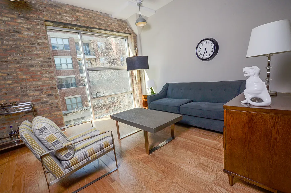 exposed brick in living room of 3141 North Sheffield Apartments in Lakeview