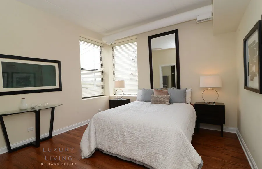 kitchen and island with wood floors at Riverview Terrace Apartments