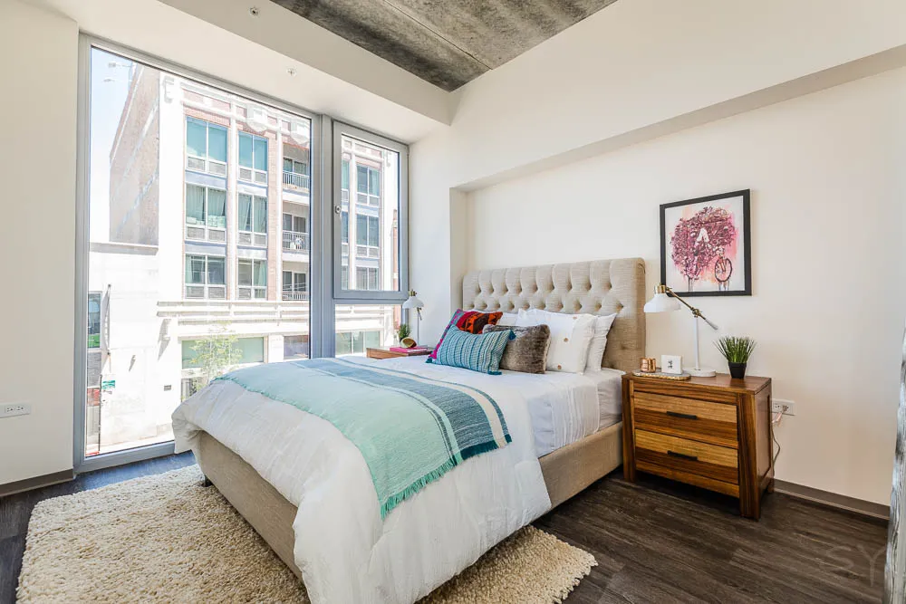kitchena nd living area with wood floors at The Western 1920 Apartments