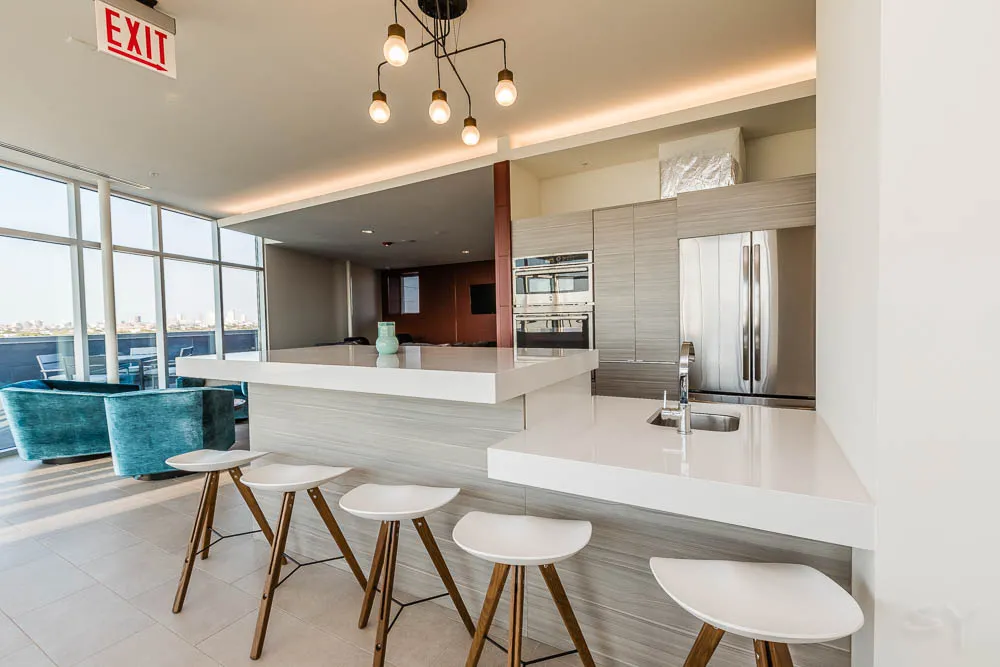 kitchena nd living area with wood floors at The Western 1920 Apartments