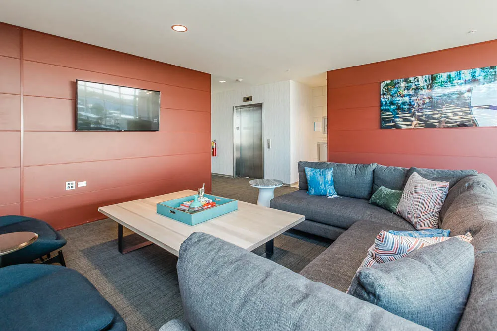 kitchena nd living area with wood floors at The Western 1920 Apartments