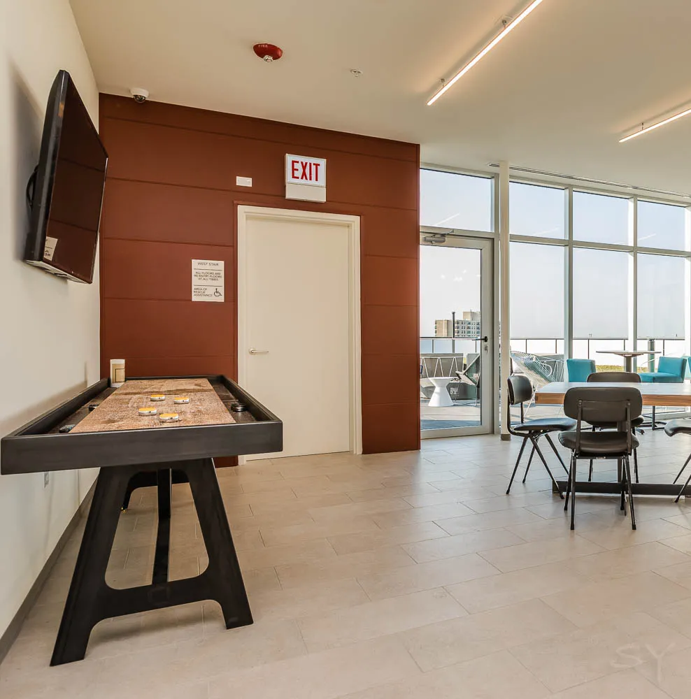 kitchena nd living area with wood floors at The Western 1920 Apartments
