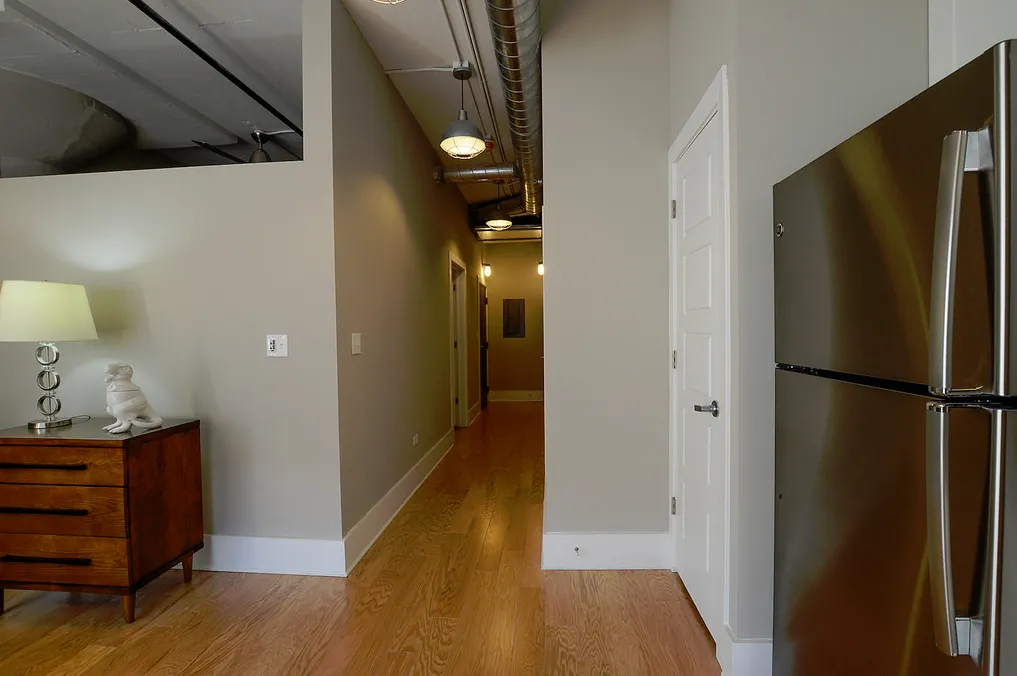 exposed brick in living room of 3141 North Sheffield Apartments in Lakeview