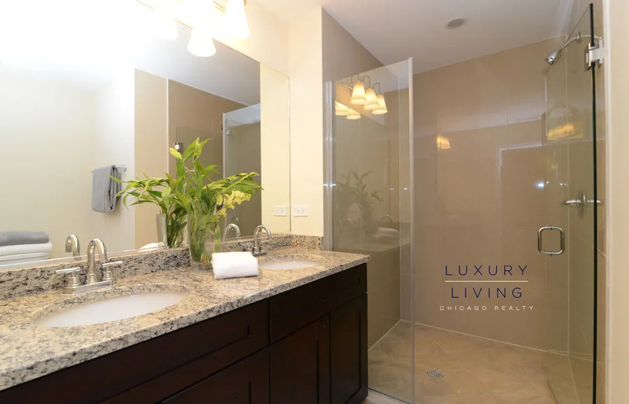 kitchen and island with wood floors at Riverview Terrace Apartments