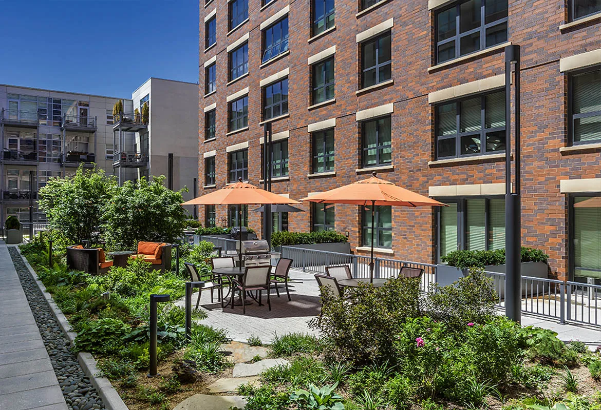 kitchen with view of living room at The Madison at Racine Apartments