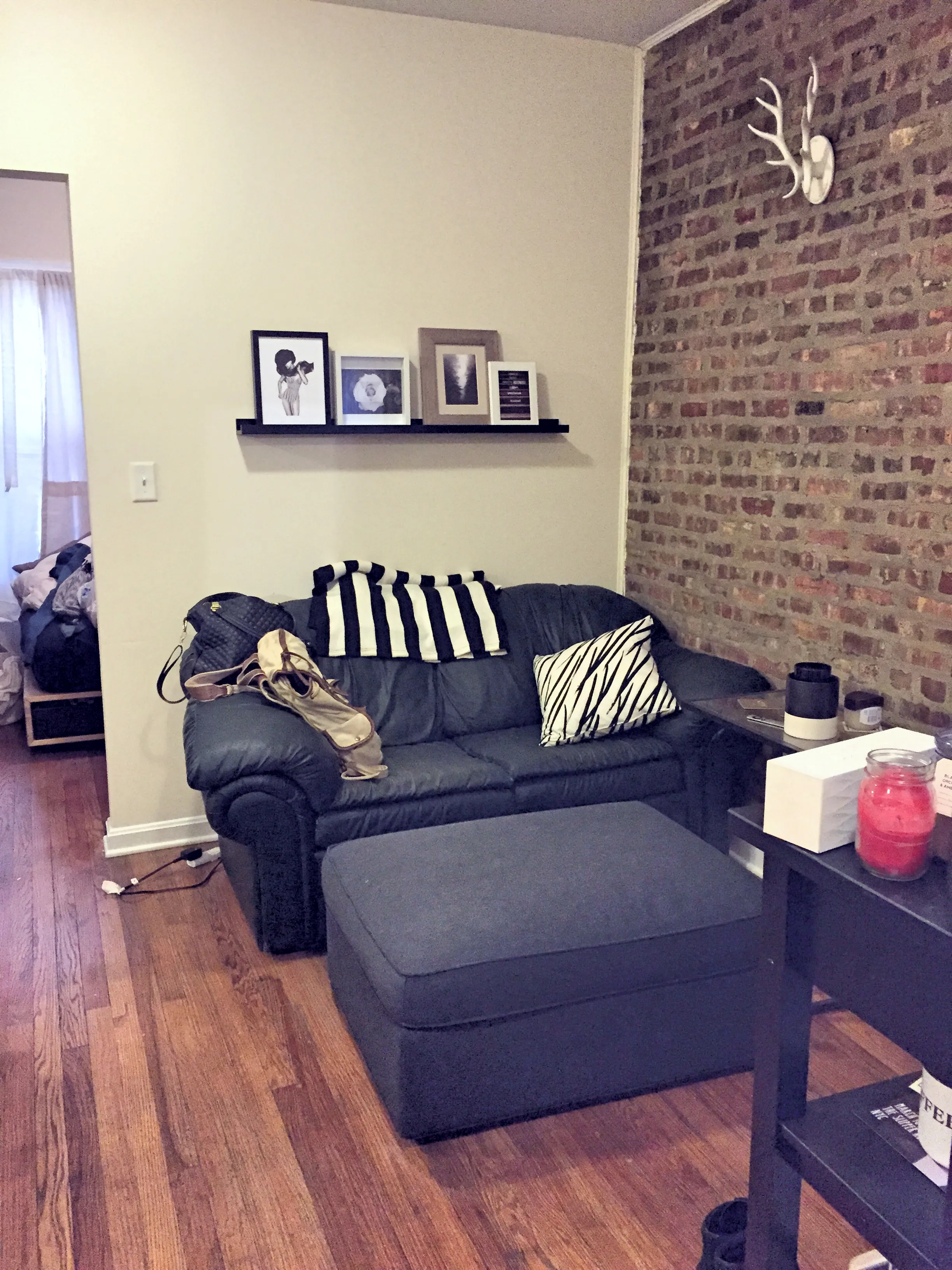 Living Area - with exposed brick wall