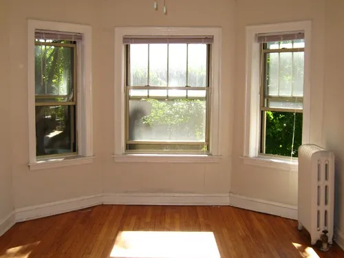 model kitchen with wood floors at 822-836 South Austin Apartments