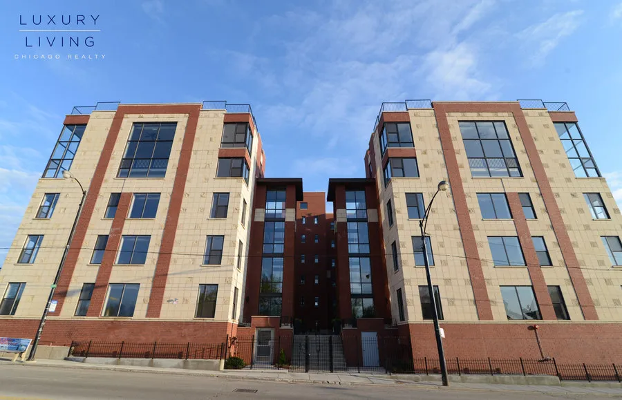 kitchen and island with wood floors at Riverview Terrace Apartments