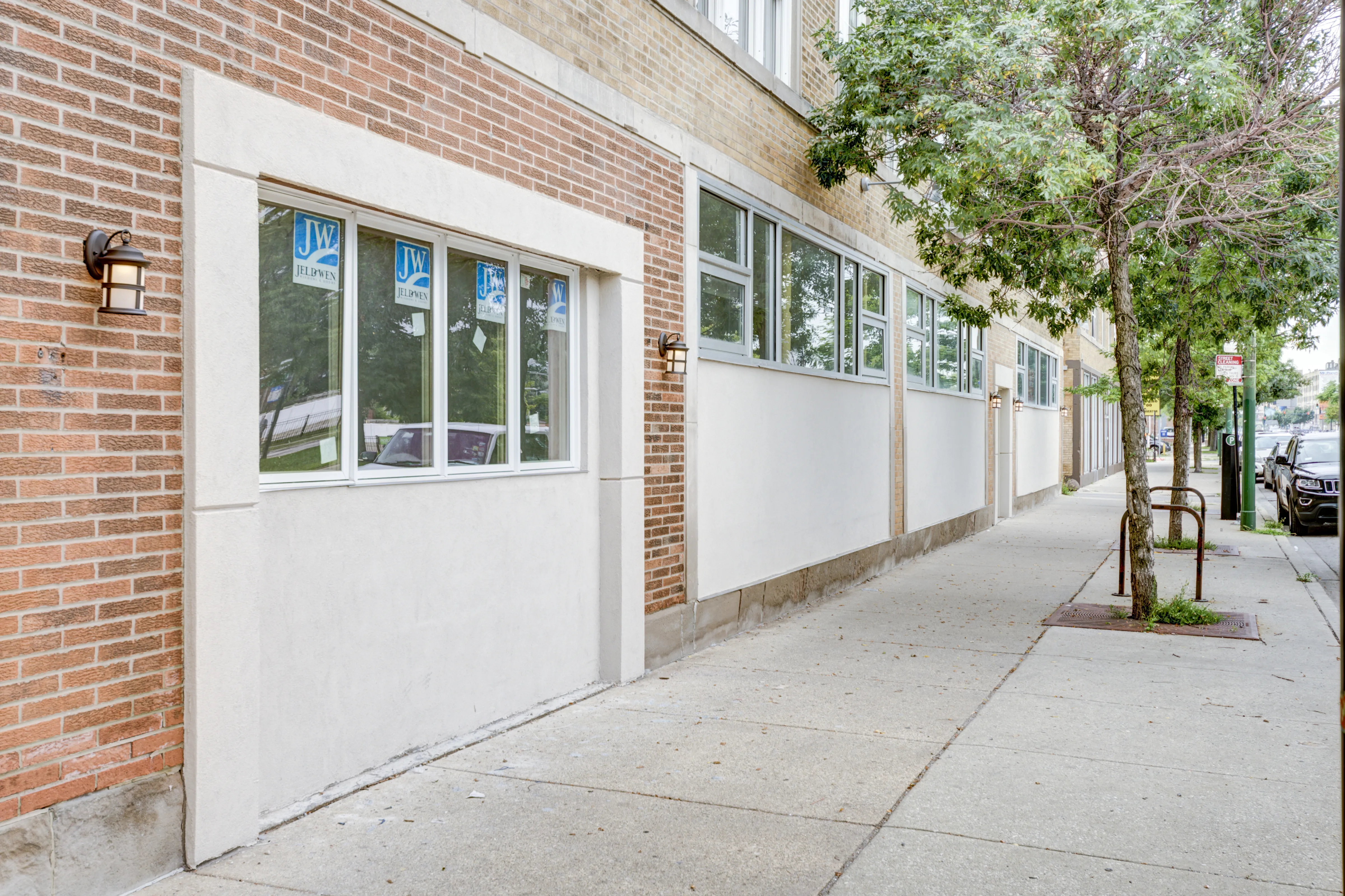 empty model living room with wood floors at 6125 North Clark Apartments