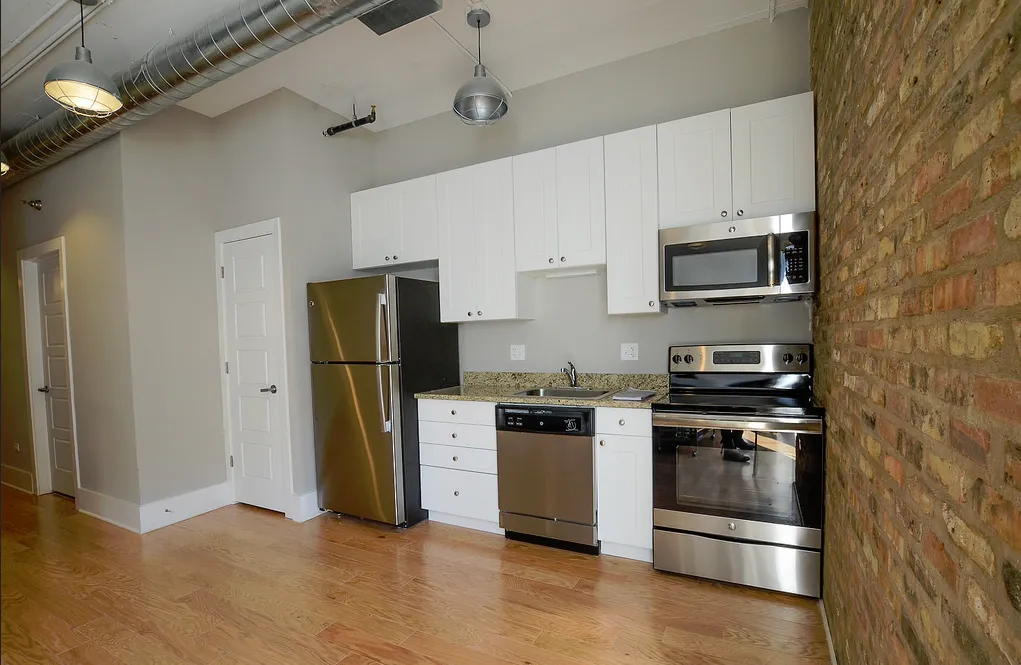 exposed brick in living room of 3141 North Sheffield Apartments in Lakeview