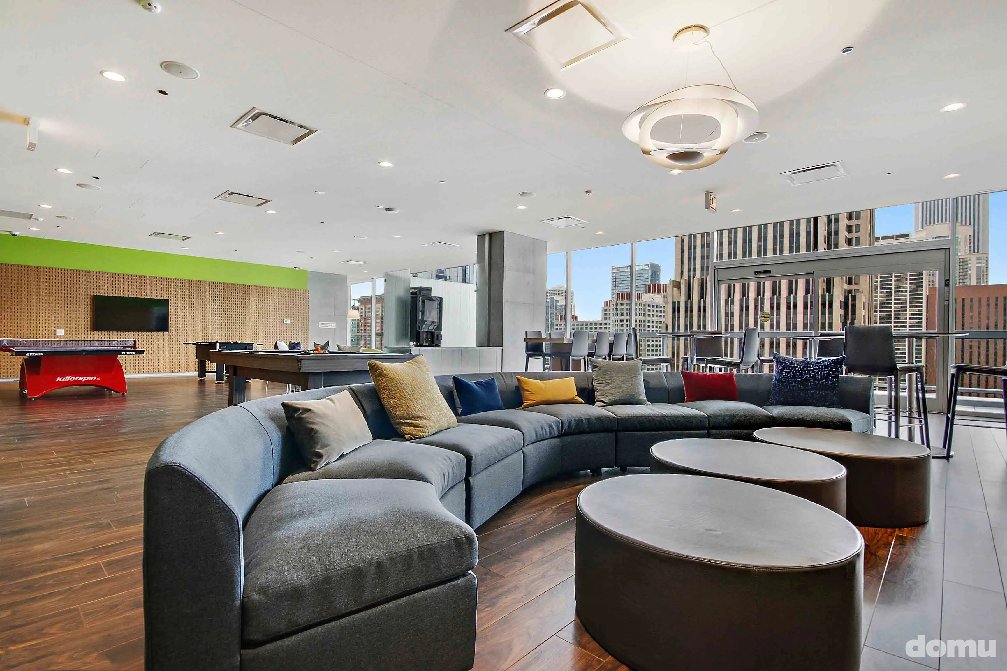 model kitchen with view of Chicago at Optima Signature Apartments