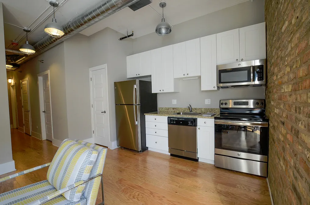 exposed brick in living room of 3141 North Sheffield Apartments in Lakeview