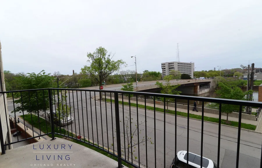 kitchen and island with wood floors at Riverview Terrace Apartments