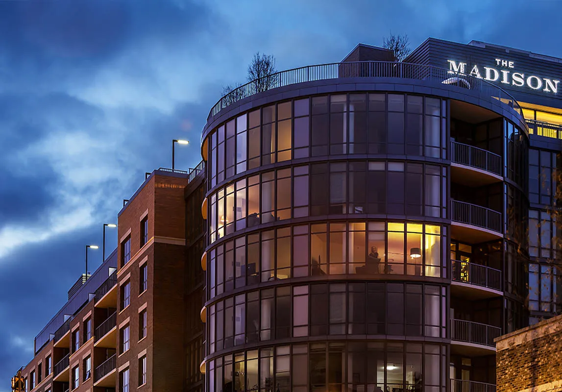kitchen with view of living room at The Madison at Racine Apartments