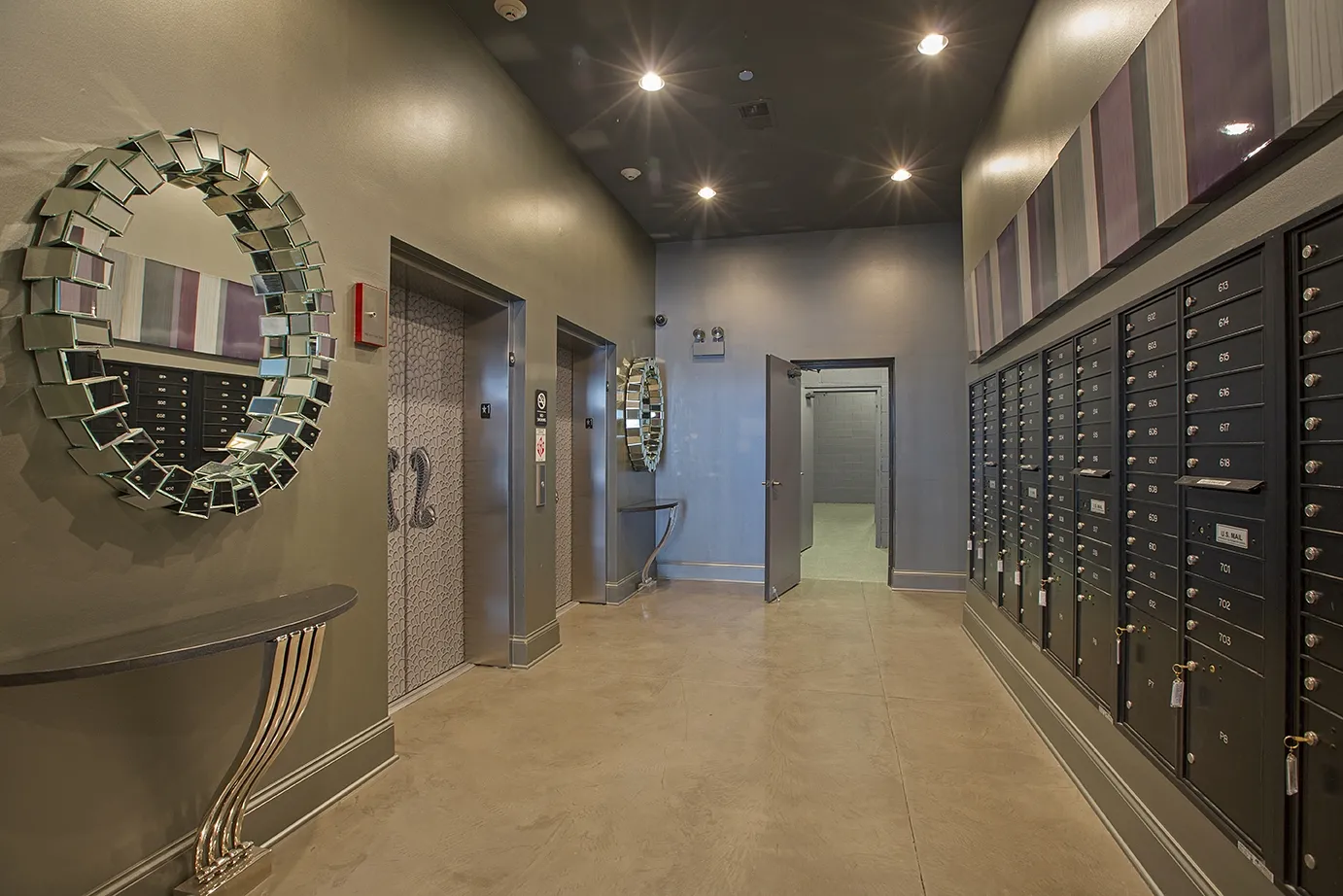 modern kitchen with brown wood cabints at The Shelby Apartments in Chicago