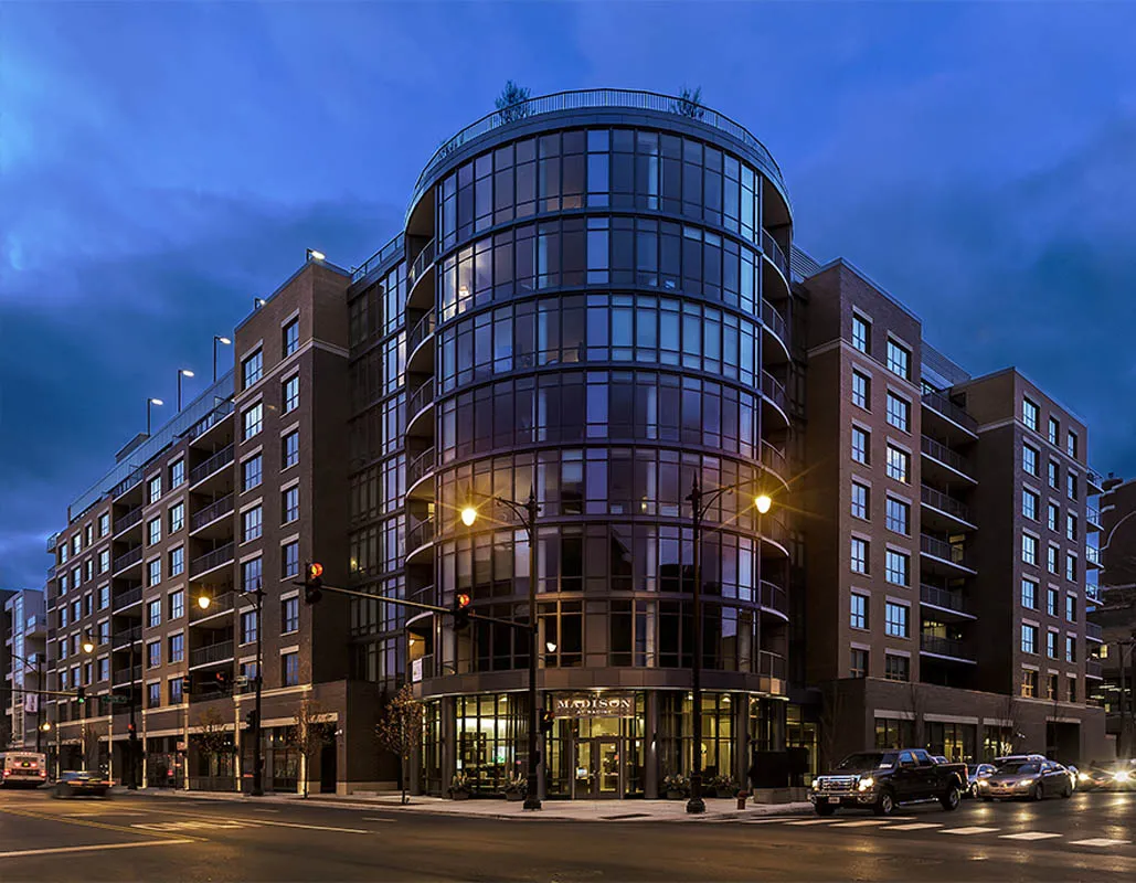 kitchen with view of living room at The Madison at Racine Apartments
