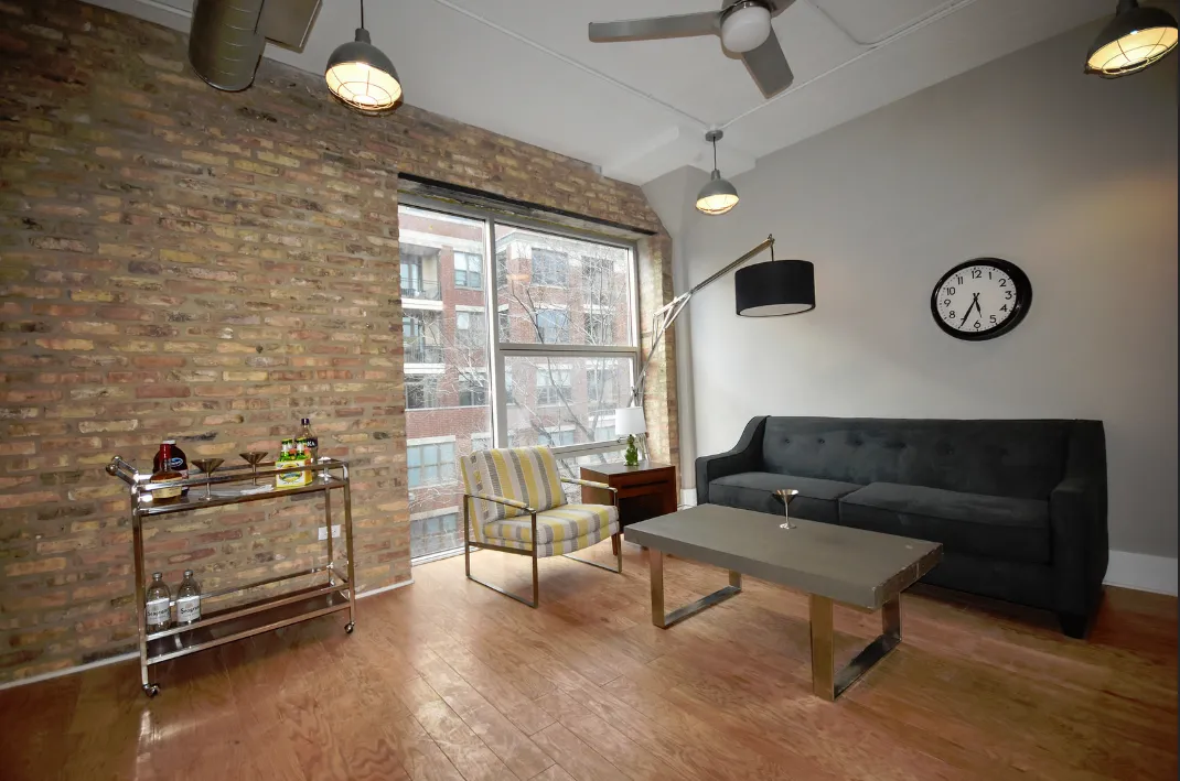 exposed brick in living room of 3141 North Sheffield Apartments in Lakeview