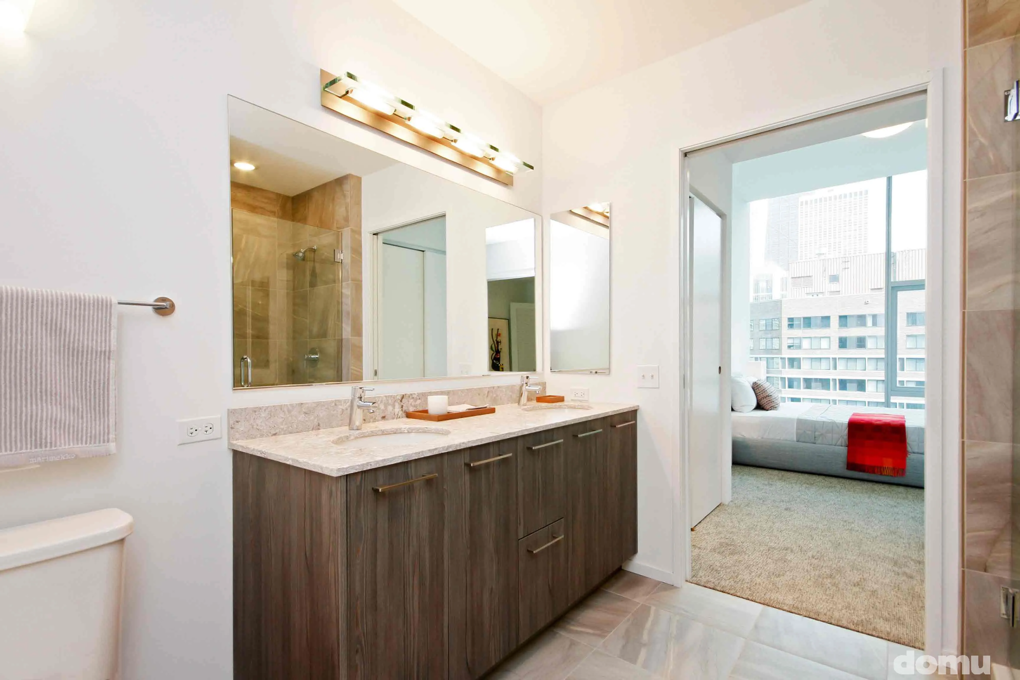 model kitchen with view of Chicago at Optima Signature Apartments