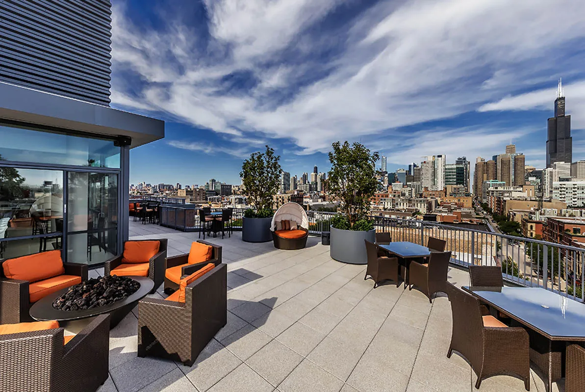 kitchen with view of living room at The Madison at Racine Apartments