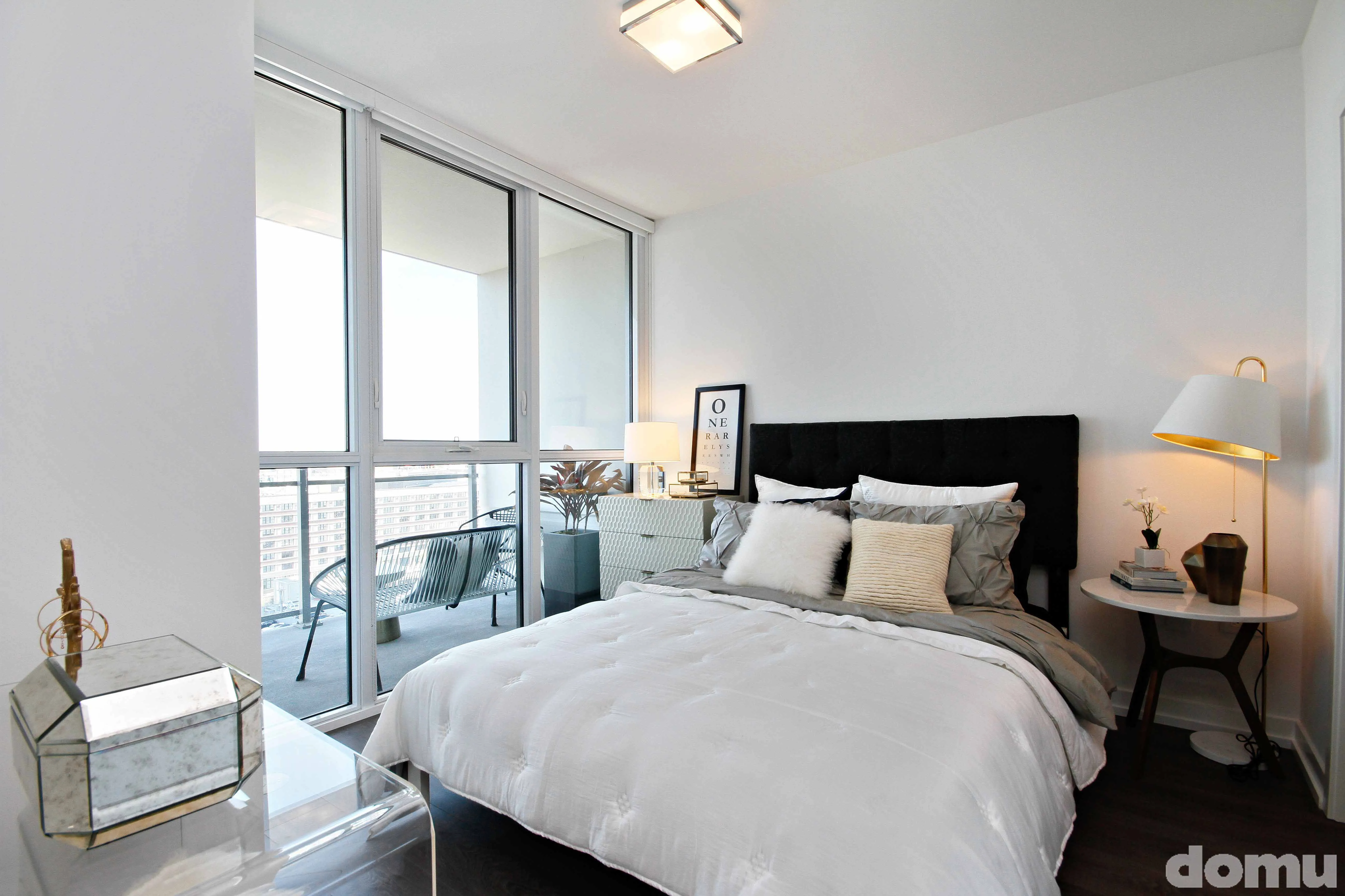 master bedroom with view at The Hudson Apartments in Chicago
