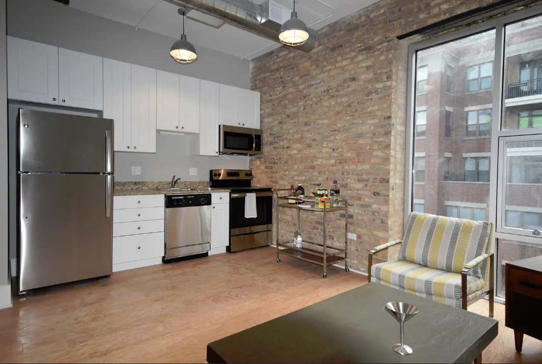 exposed brick in living room of 3141 North Sheffield Apartments in Lakeview