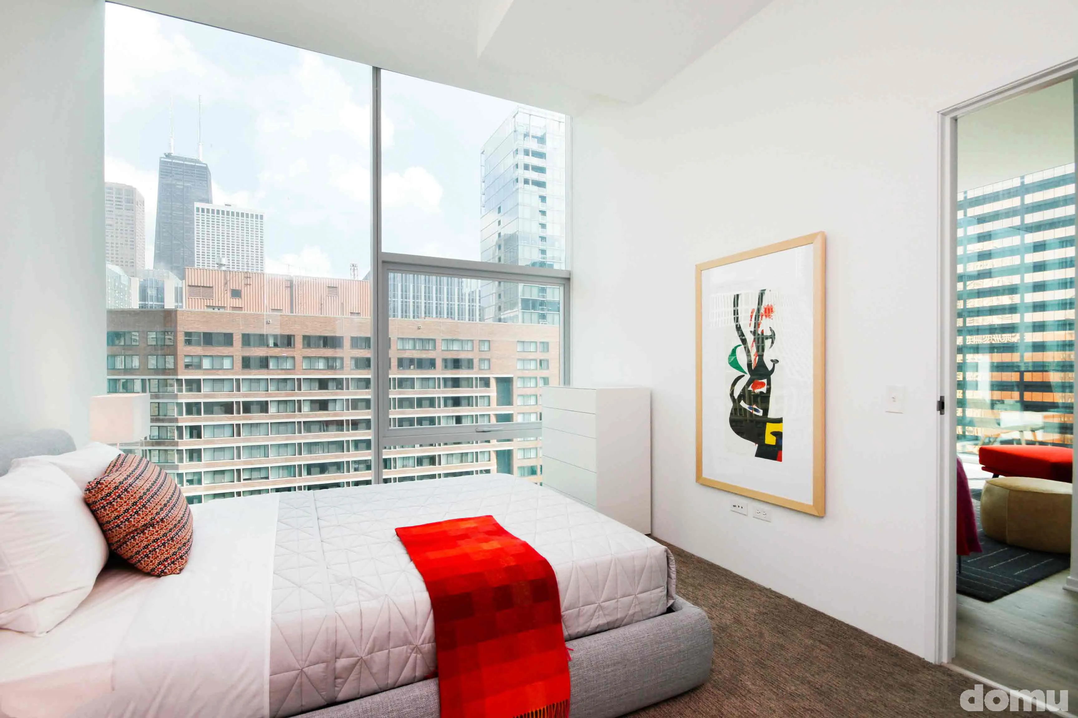 model kitchen with view of Chicago at Optima Signature Apartments