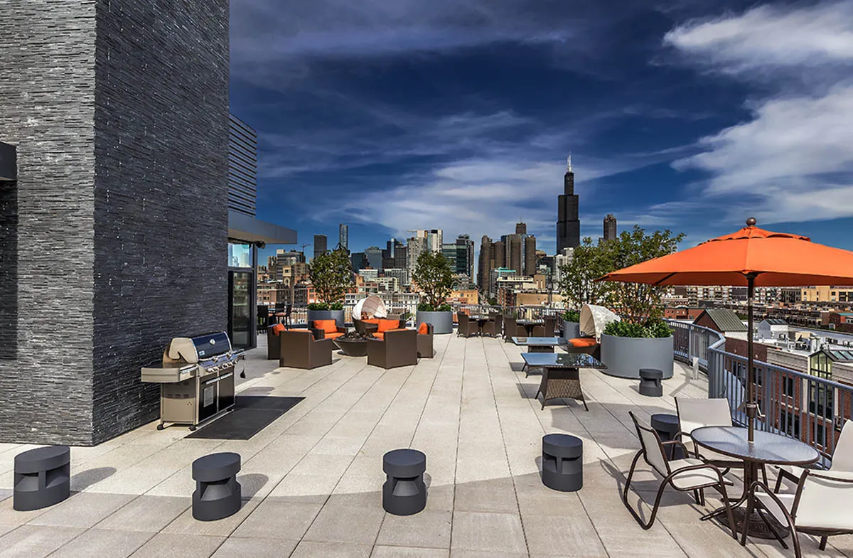 kitchen with view of living room at The Madison at Racine Apartments