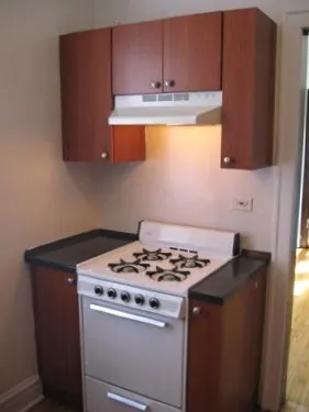 model kitchen with wood floors at 822-836 South Austin Apartments