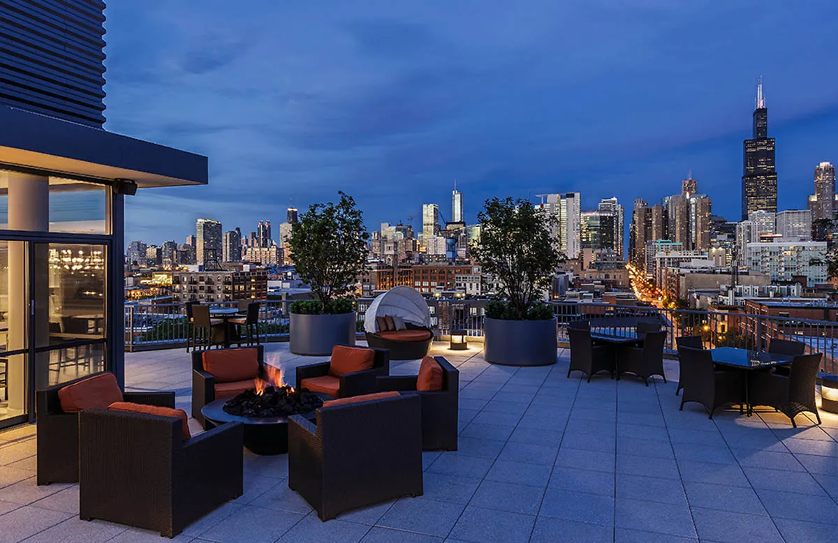 kitchen with view of living room at The Madison at Racine Apartments