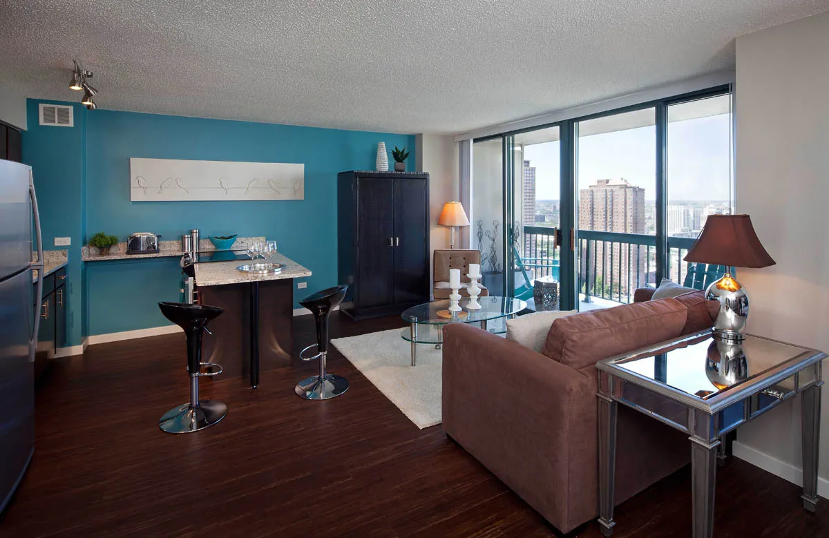 model living room with furnishings at One Superior Place Apartments