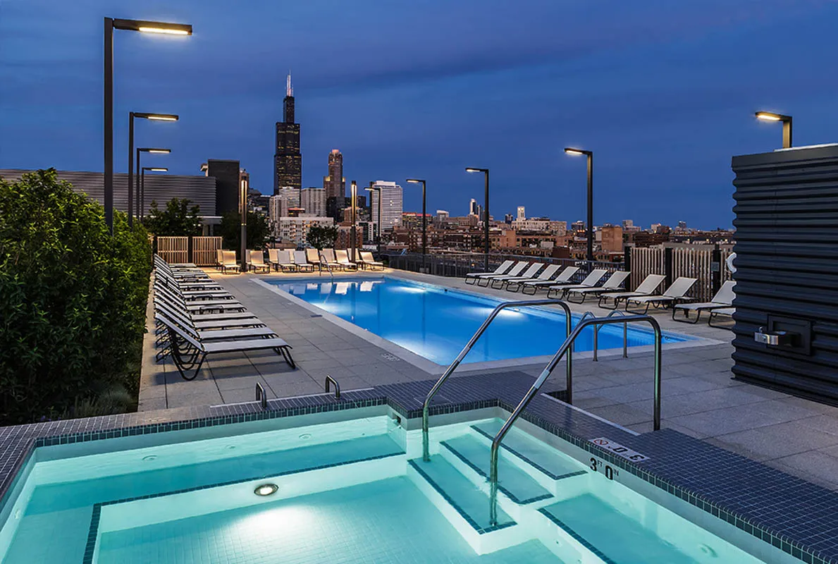 kitchen with view of living room at The Madison at Racine Apartments