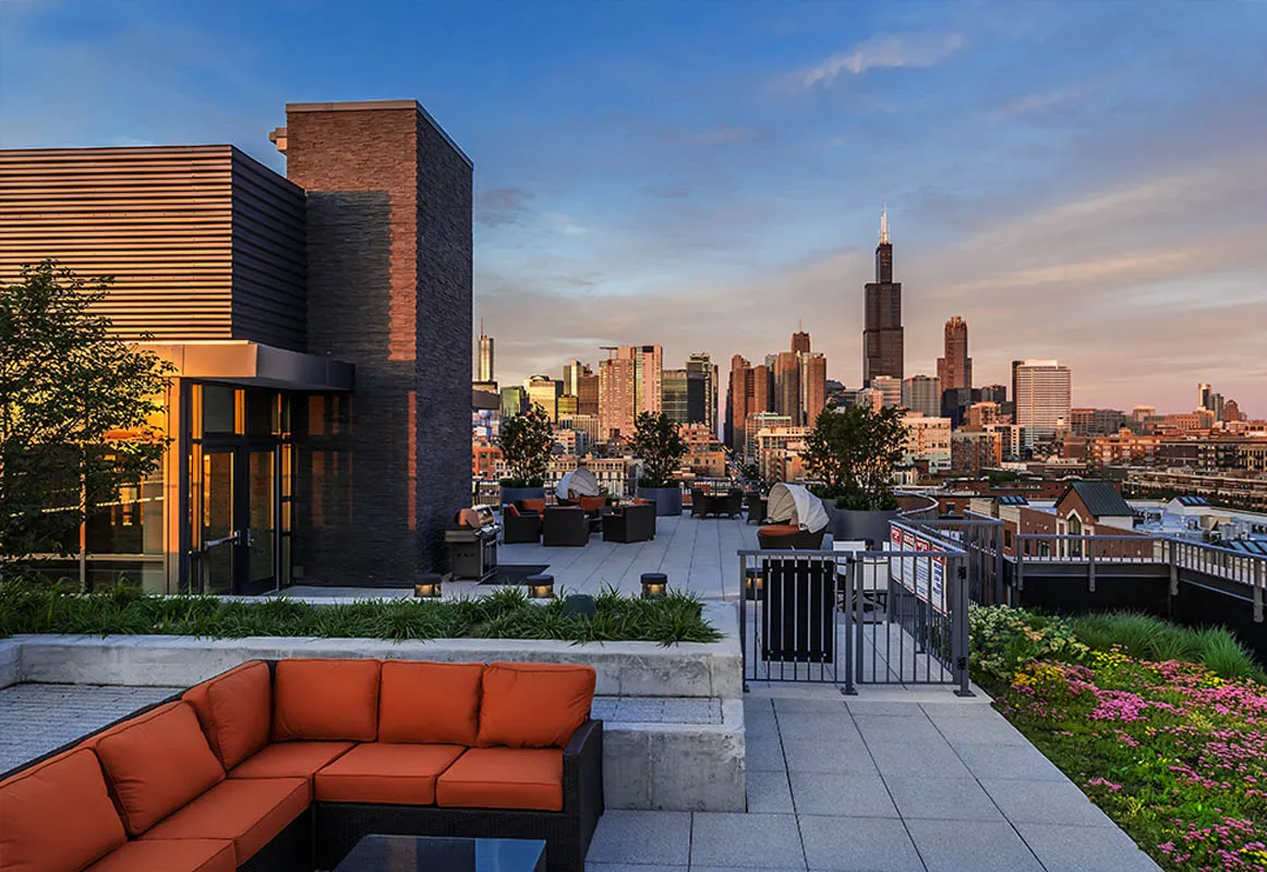 kitchen with view of living room at The Madison at Racine Apartments